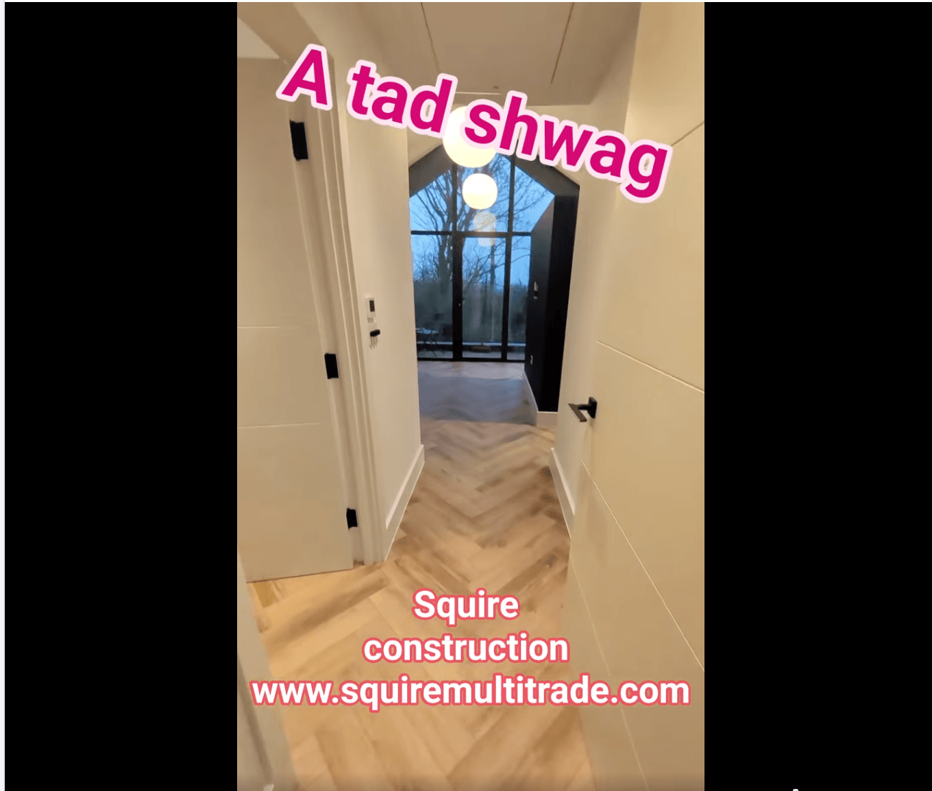 Vaulted hallway with herringbone floor and apex window — captioned 'A tad shwag · Squire construction'.